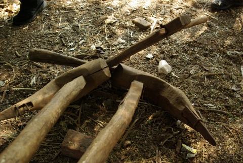 Wooden plow with iron reinforcement.